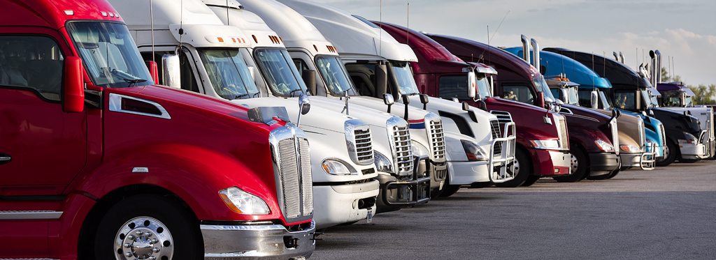 Motor carrier trucks parked in a line